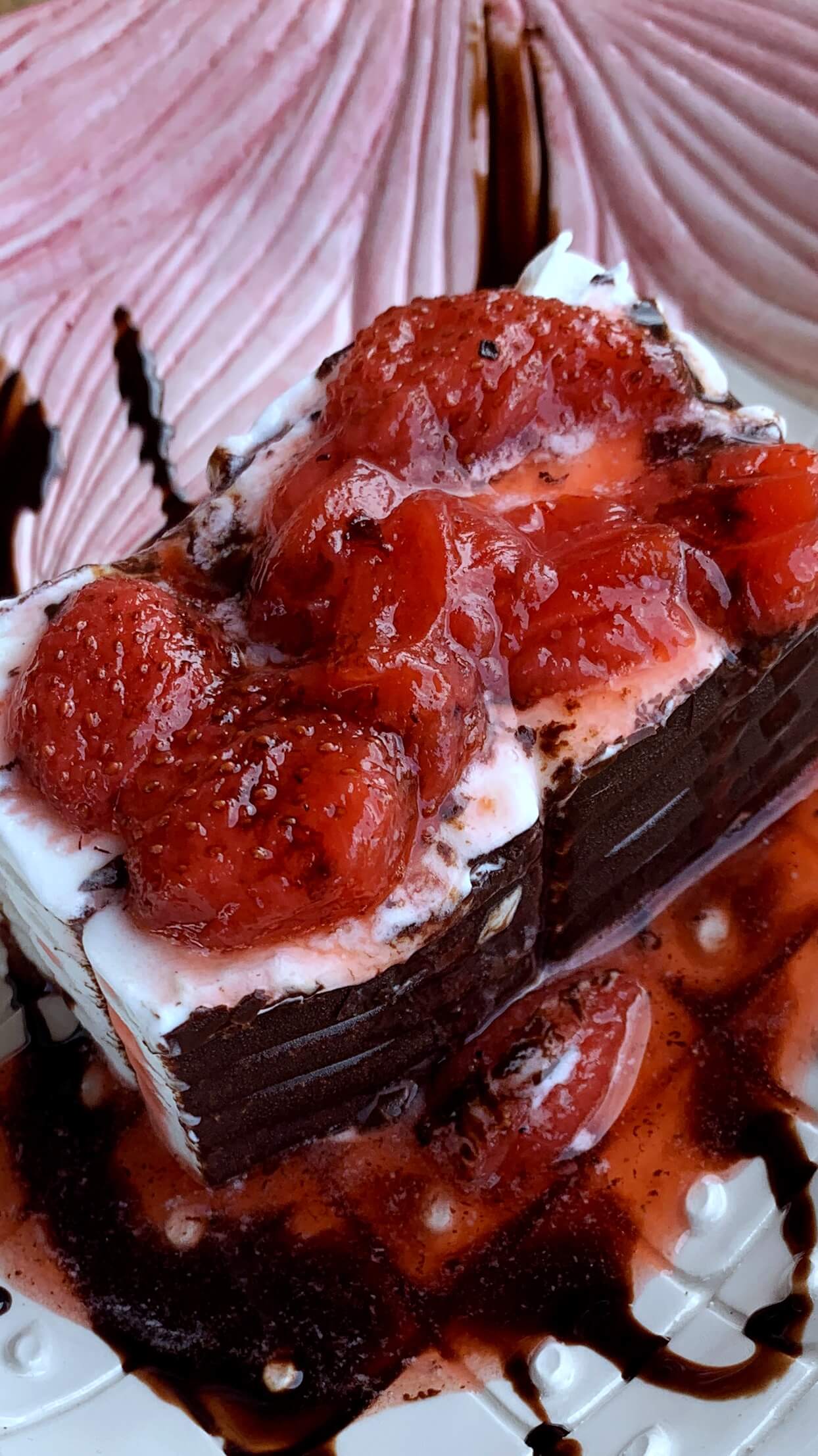 Ice cream cake with hot strawberries sauce